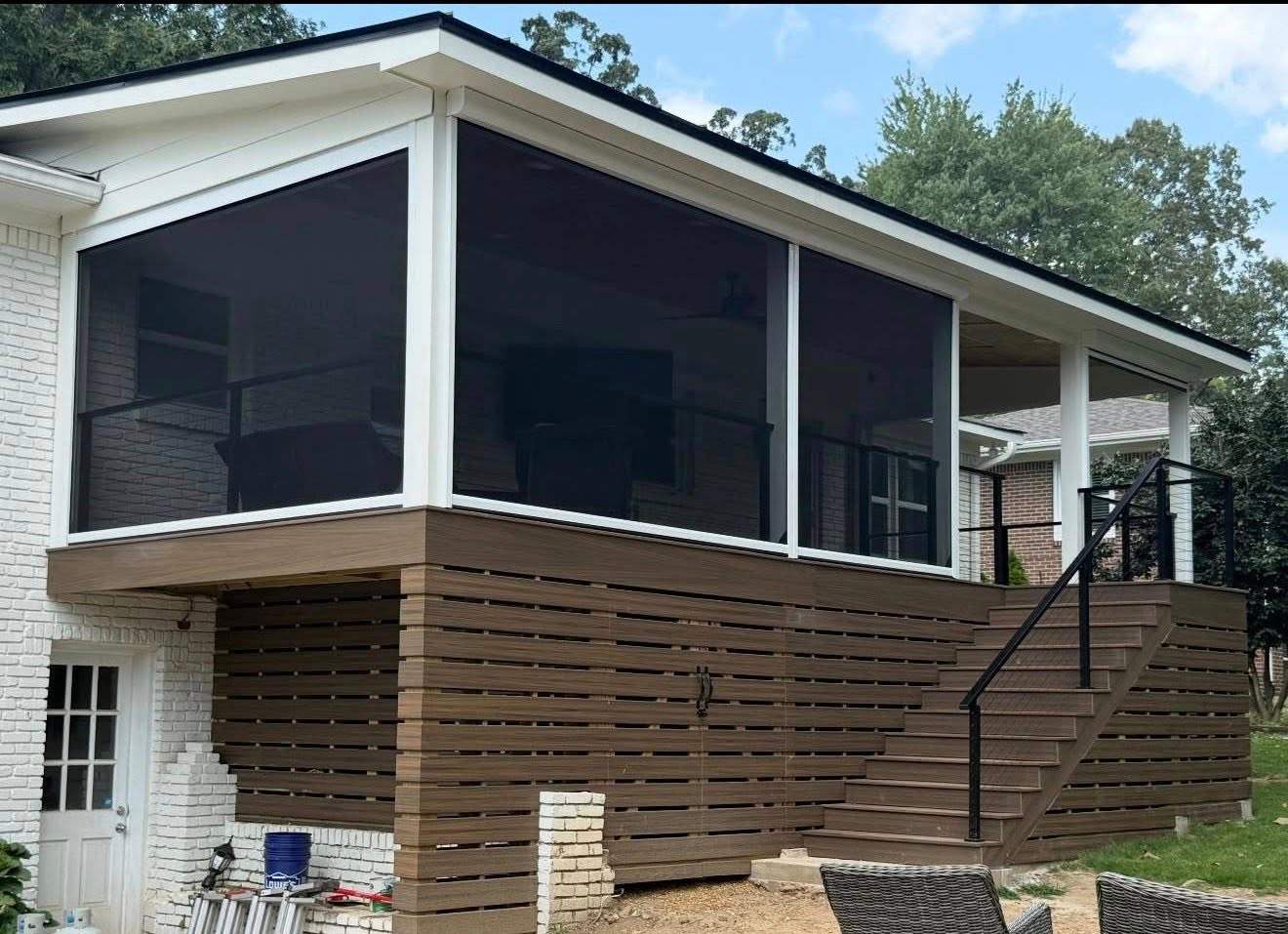 Completed custom screened-in deck with dark composite finishes and horizontal privacy lattice in Vestavia Hills, AL.