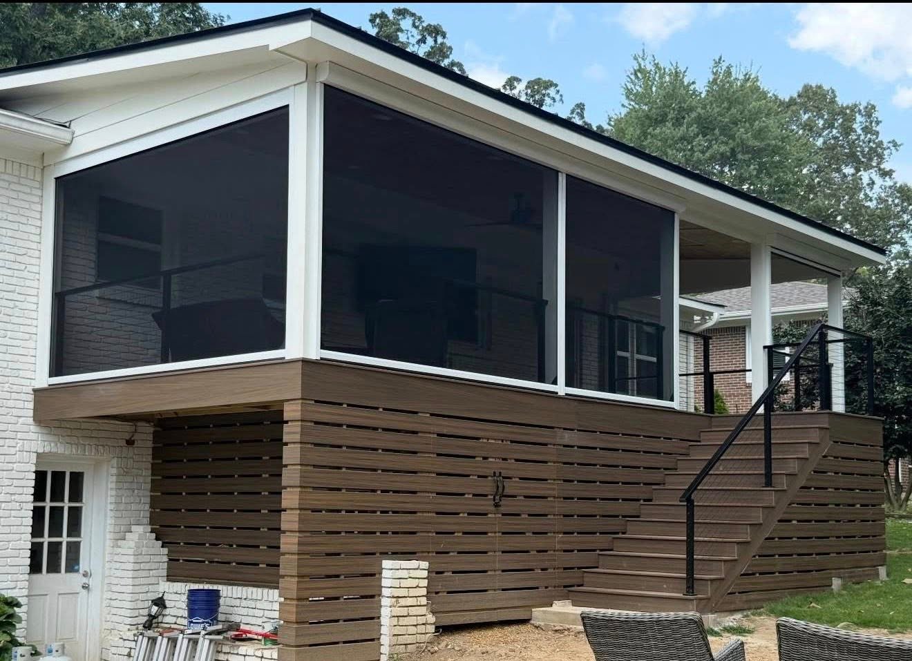 Completed custom screened-in deck with dark composite finishes and horizontal privacy lattice in Vestavia Hills, AL.